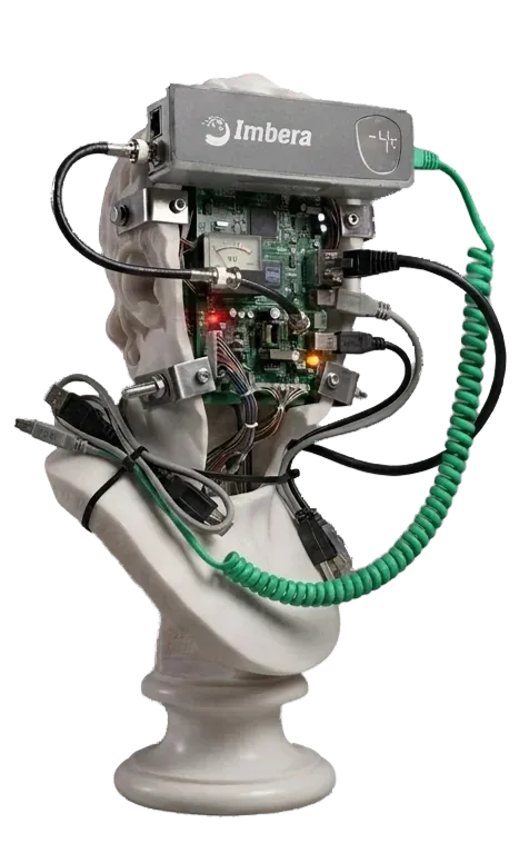 Plaster head with a circuit board and green cables.