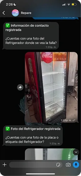WhatsApp chat showing an Emerald Intelligence agent logging a photo of a refrigerator